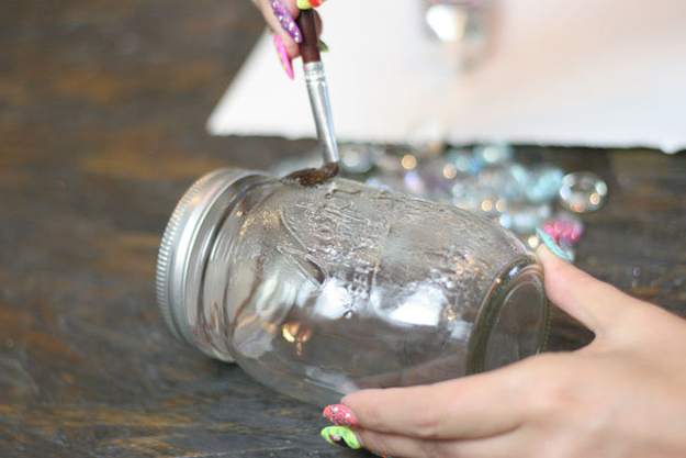Brush on glue to a small area of the mason jar.