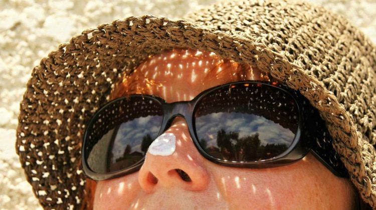 Featured | Woman with sunglasses | Primitive Sun Block Methods and Burn Remedies
