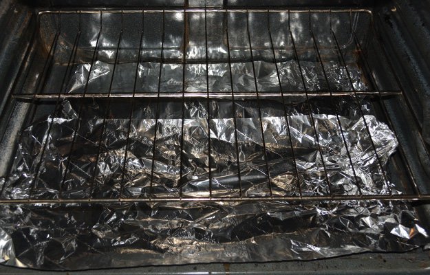 Line oven with foil and arrange the meat in the oven rack | Venison Jerky Recipe