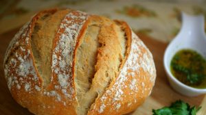 Freshly coked bread in wooden background | Pioneer Recipes That Survived The Oregon Trail | Featured