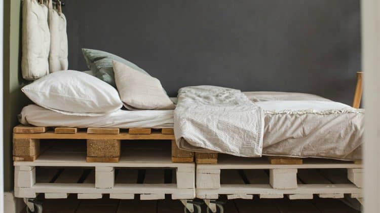 Feature | A industrial style bedroom with recycled pallet bed frame designs | Pallet Projects To Use Around The Homestead