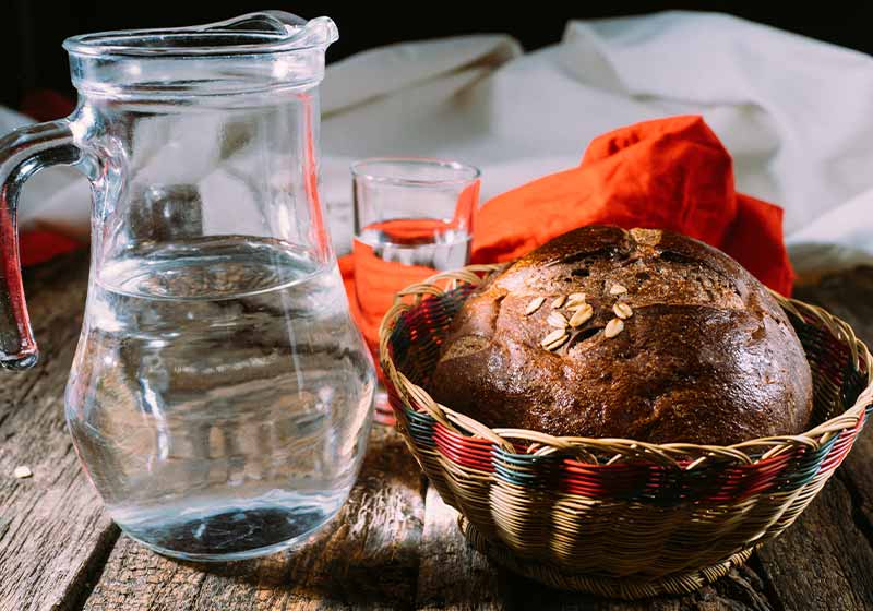 Homemade wholemeal bread in a wicker bread basket