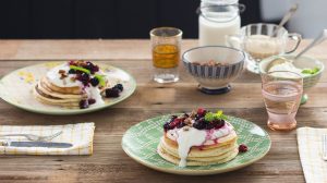 Featured | Pancakes with cream toppings on plates | Family Thanksgiving Breakfast = Homemade Pancakes | 21 Mouthwatering Pancake Recipes