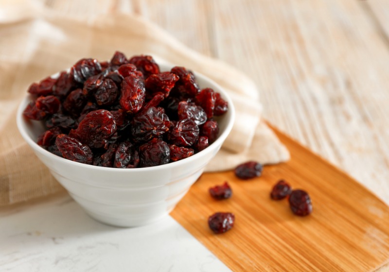 dried cranberries bowl on light table | how to dehydrate fruit in oven