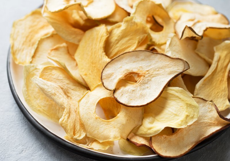 various fruit chips on white background | fruit drying process