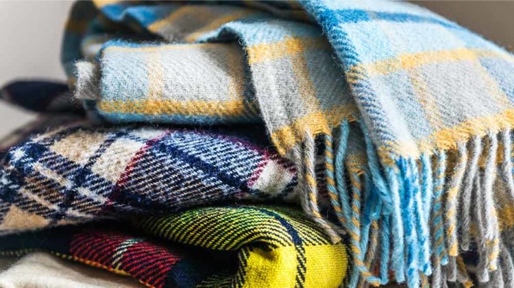 Stack of woolen checked blankets | DIY Warm Winter Blankets To Keep Away The Winter Chill | featured