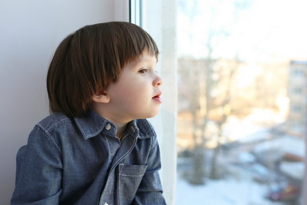 7 Indoor Activities For Kids This Winter | Snow Day! kid looking out window