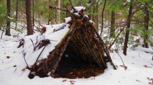 Primitive Survival A Frame Debris Shelter in the cold winter snow | Survival Winter Shelter: How To Build A Debris Hut | featured