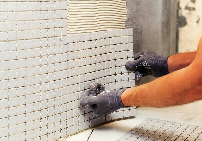 installation mosaic tiles worker fixes tile | garage organization planning