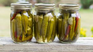 Featured | Canned vegetables background includes pickled okra with garlic and peppers | Pickled Okra Recipe | Homesteading Canning Ideas