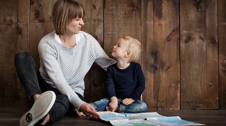 Feature | Child with woman holding map | How To Homeschool On The Homestead | Tips, Ideas, And Guide