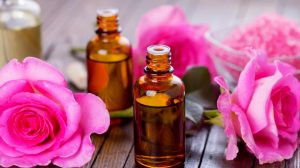 ​Essential aroma oil with roses on wooden background | How To Make Essential Oils At Home | Homesteading Skills | featured