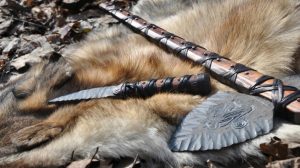 Featured | Stone knife and ax on the skin of a wolf | How to Make a Knife in a Survival Situation