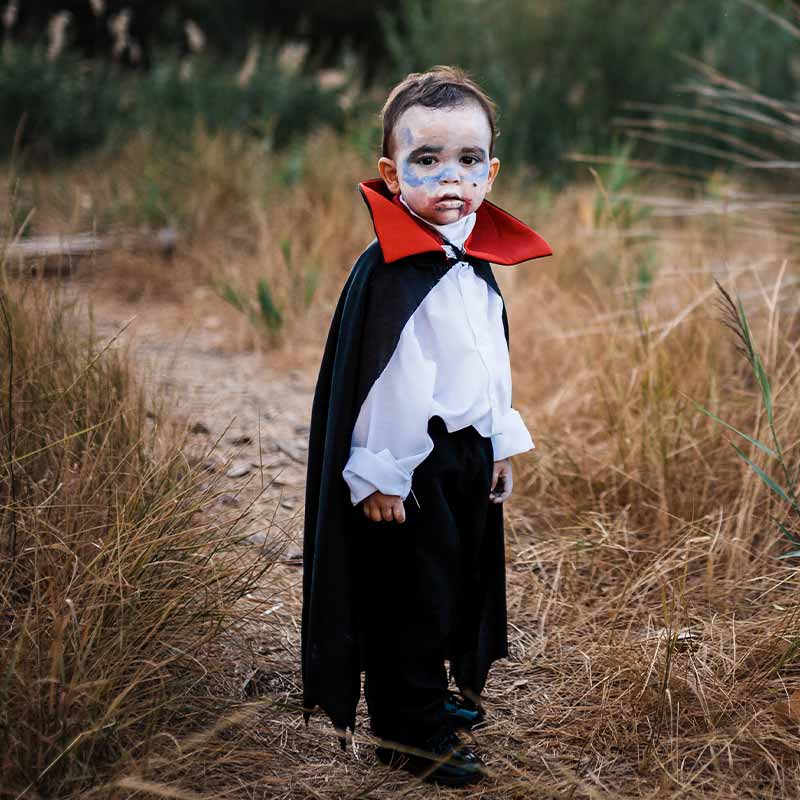 Kid serious costumed of dracula to halloween on the forest |classic halloween costumes