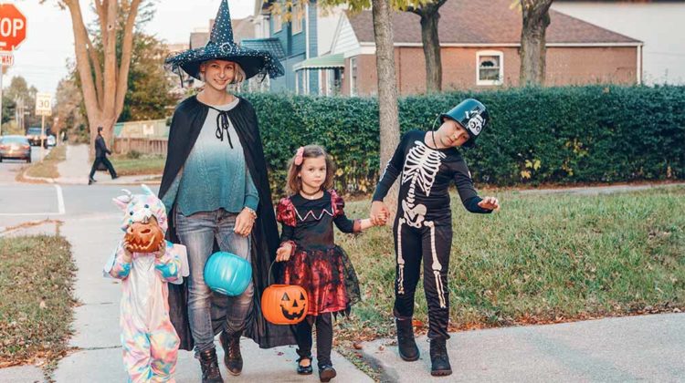 Mother with children going to trick or treat on Halloween holiday | Classic Halloween Costumes For Timeless Trick or Treating | Featured