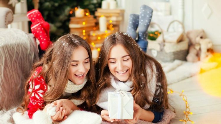 Beautiful young sisters twins teens. Christmas and New Year. Cosy holiday at the fireplace | Super Cool DIY Christmas Gifts For Teens | for teenage guys | Featured