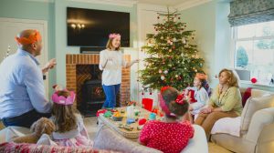 family playing christmas charades | Christmas Party Games For Your Holiday Gathering | christmas party games | funny christmas party games | Featured