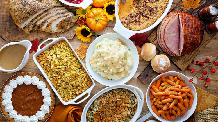 Thanksgiving table with roasted turkey, sliced ham and side dishes | Thanksgiving Side Dishes | Best Thanksgiving Side Dishes Recipes | easy thanksgiving side dishes | Featured