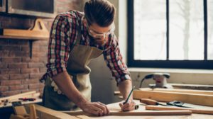 bearded handsome cabinetmaker tabletop pencil drawing | A Basic Carpentry Skills Guide For Homesteaders | featured