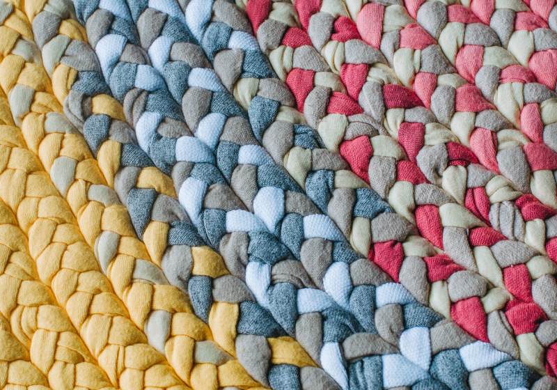 How To Make a Braided Rug | closeup colorful handmade rug variety different | how to make a braided rag rug