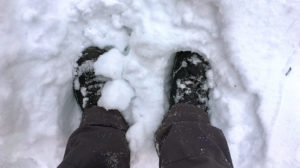 Male feet stand on fresh snow | Cold Weather Hacks To Keep You Safe And Cozy This Winter | Cold Weather Hacks To Keep You Safe And Cozy This Winter | Featured