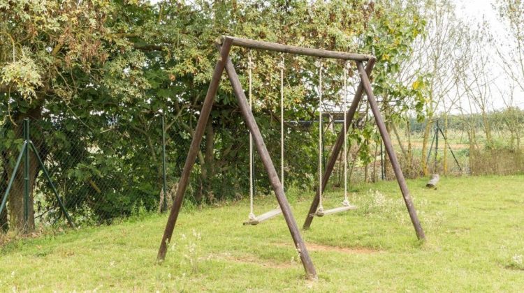 Swing In Backyard | How to Build a Wooden Swing Set That Your Kids Will Love | Featured