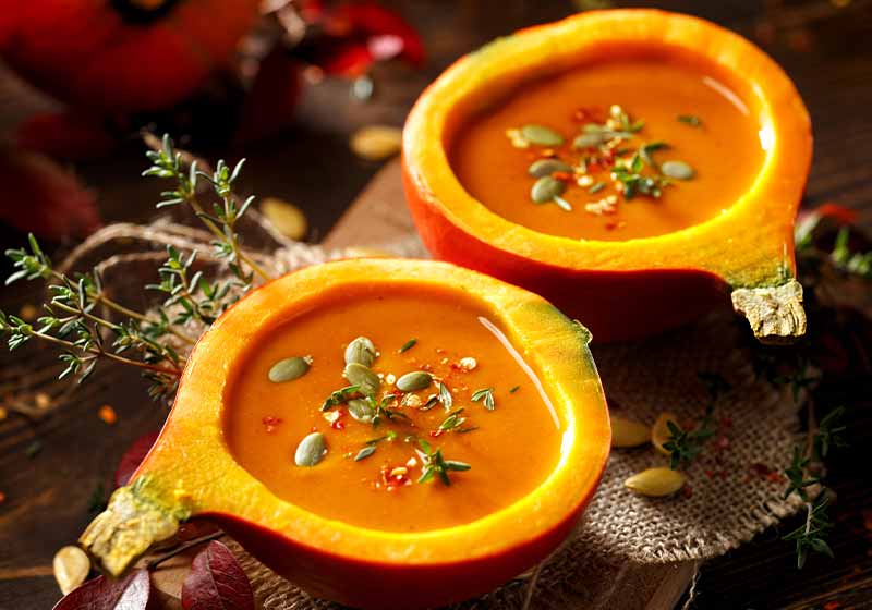 pumpkin-soup-served-hollowed-pumpkins | food network