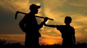 Farmer father and son silhouette | Why Homesteaders Should Practice Subsistence Farming Now | Featured