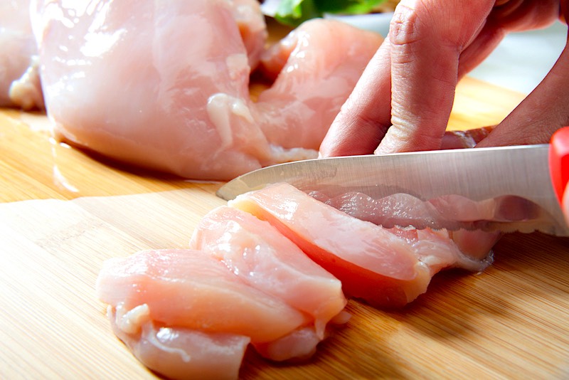 Cutting Raw Chicken Breasts | A Step-by-Step Guide To Canning Chicken Safely At Home