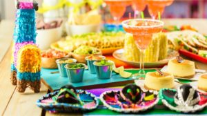 Fiesta party buffet table with traditional Mexican food | Easy DIY Cinco de Mayo Decorations For Your Fiesta At Home | cinco de mayo crafts | Featured