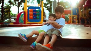 kids in playground | DIY Wooden Playhouse Ideas You Can Build For Your Kids | wooden playhouse | Featured