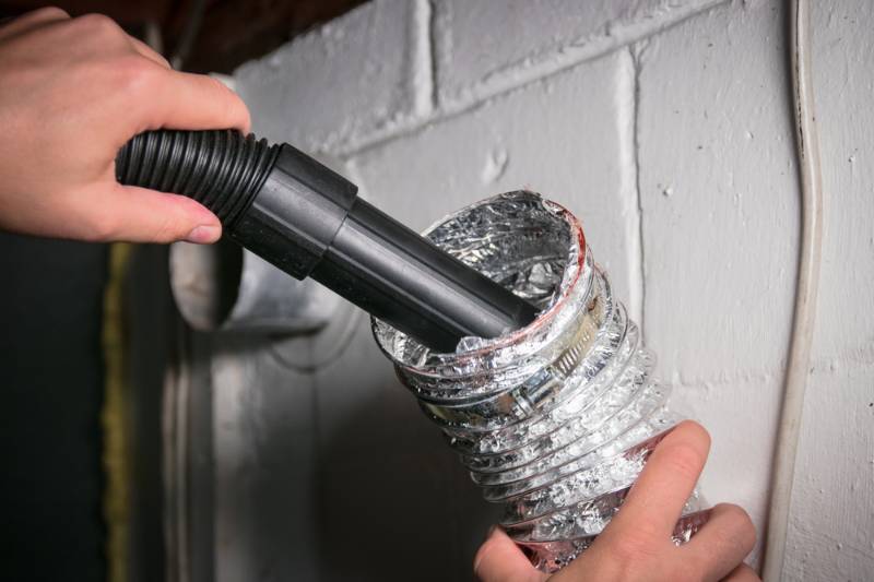 vacuum-cleaning-flexible-aluminum-dryer-vent | Fall Home Maintenance Checklist: How To Prepare Your Home For Fall