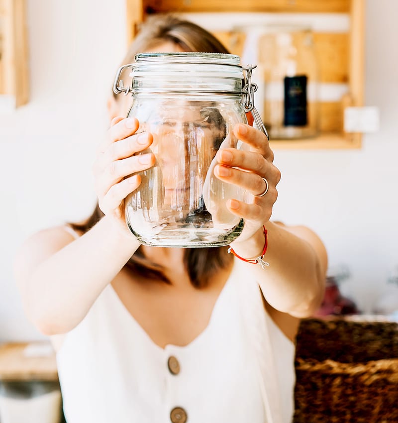 woman holding an empty jar | duck egg recipe
