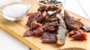 beef-jerky-pieces-dried-meat-on | Homemade Teriyaki Beef Jerky Recipe | Featured