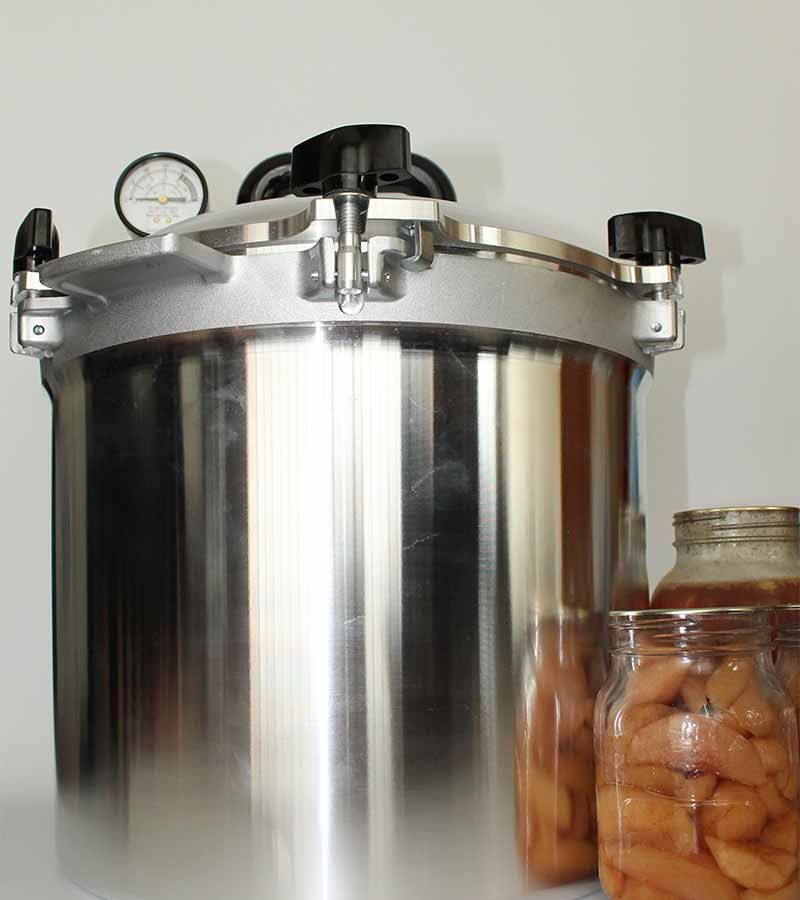 All american canner with jars of preserved food, preserved food through pressure canning method 