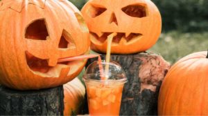 Halloween cocktail near pumpkins decoration | 15 Halloween Punch Recipes To Serve At Your Home Party | featured