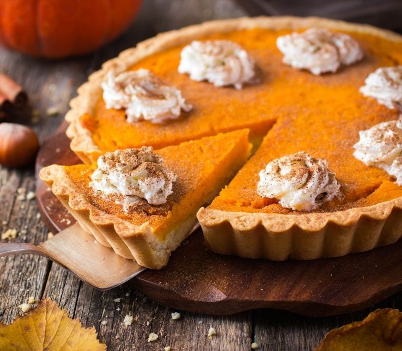 Pumpkin pie with whipped cream and cinnamon| best thanksgiving menu ideas