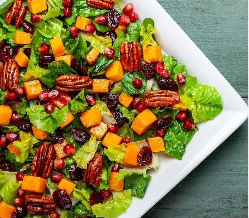 Salad with roasted pumpkin dried cranberry pecan and pomegranate