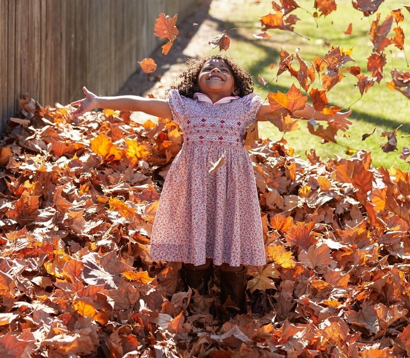 Toddler kid girl playing with autumn leaves | autumn