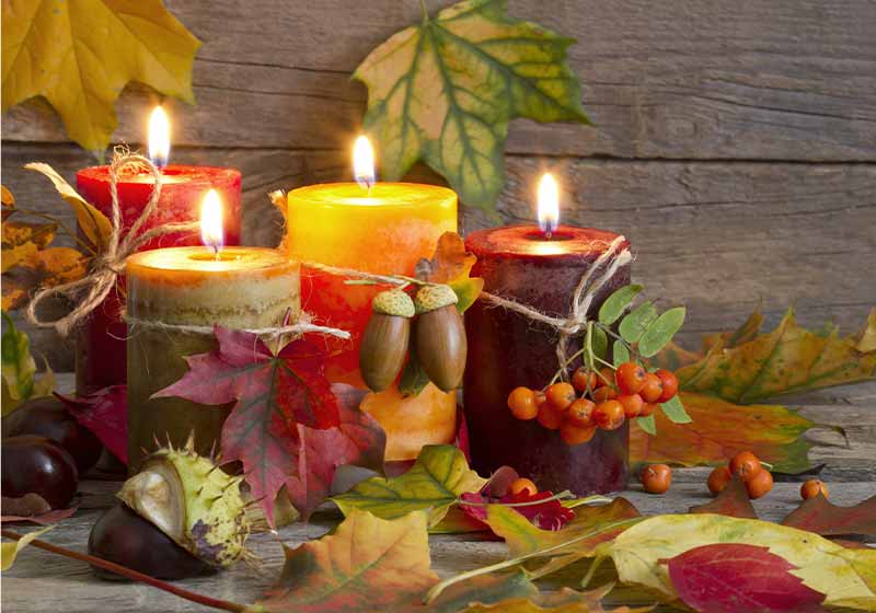 Autumn candles with leaves vintage abstract still life in night | thanksgiving table decor