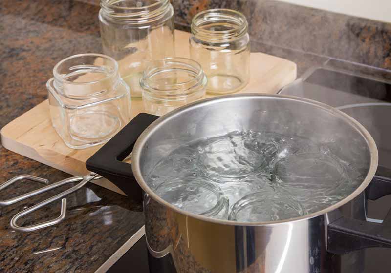 Boiling glass jars for sterilization and preparing homemade jam | canning kit