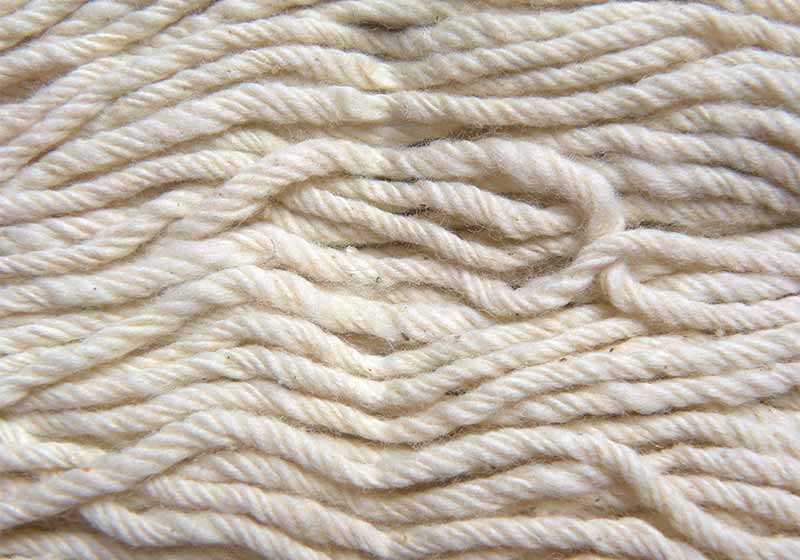 Close up of white cotton wicks of oil lamp | Candle Making Supplies Guide