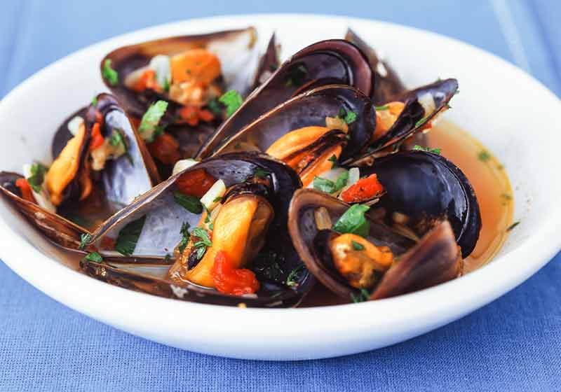 Cooked mussels marinated with vegetables in broth | thanksgiving dinner recipes