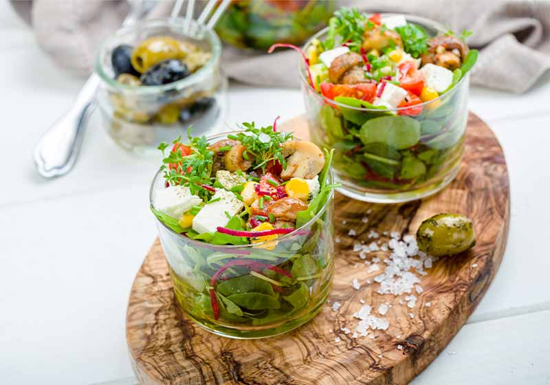 Salad in glass with pickled mushrooms and watercress | picnic food list