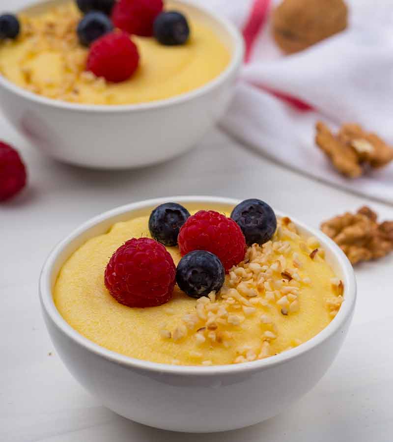 Two bowls of light yellow cornmeal porridge | pilgrim food 