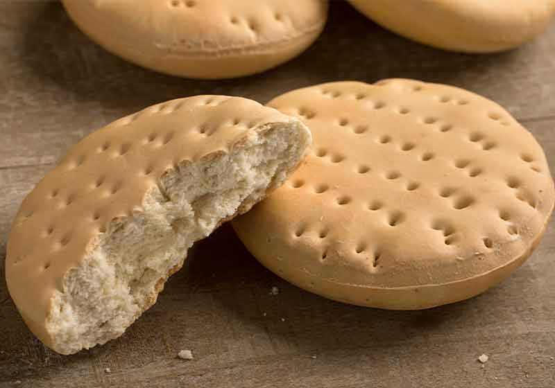 Whole and halved fresh hardtack on the table for a snack | popular thanksgiving food