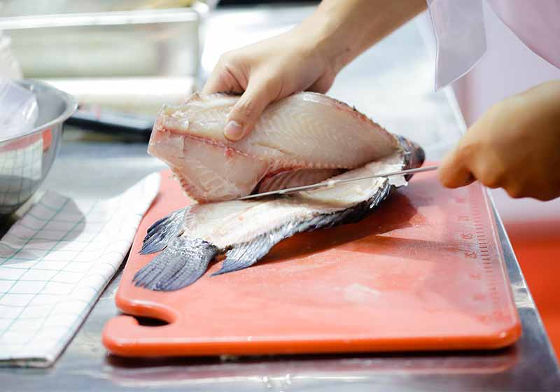 chef cutting red fish in the kitchen | how to fillet every fish