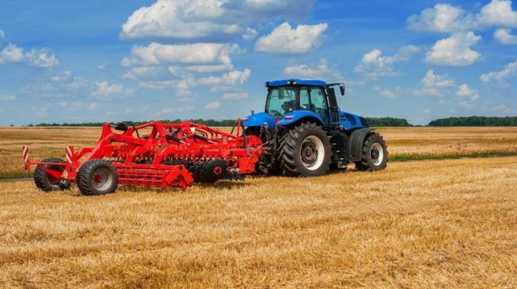 Blue tractor with pulls red harrow | 48 Tractor Accessories You Can Find On Amazon | Featured