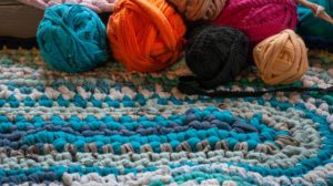 pink rag rug with balls of tshirt wool.,cosy weekend | Rag Rug | How To Make a Rug [Rag Rugs Infographics]