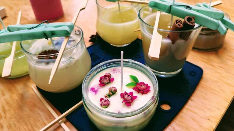 Homemade candle making session using soy wax and assorted glass containers | Candle Making Supplies Guide | featured